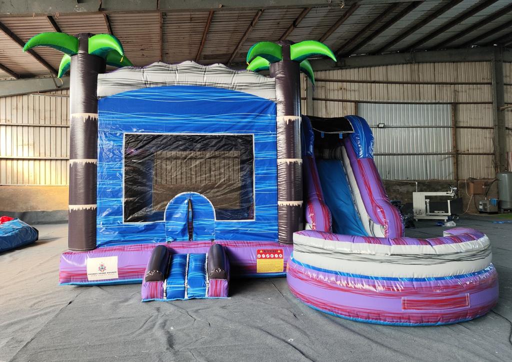 Tropical Jumping Castle with Slide available for hire from Sydney Prime Bounce